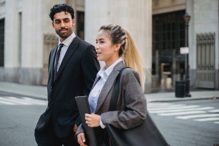 two professional people walking
